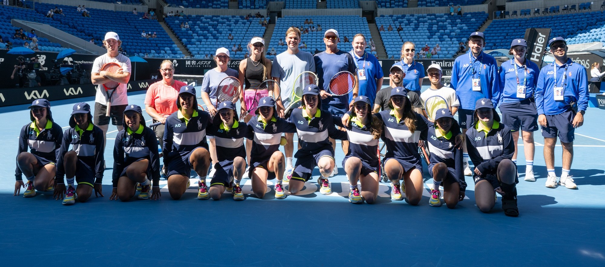 Australian Open ballkid squad and players on court